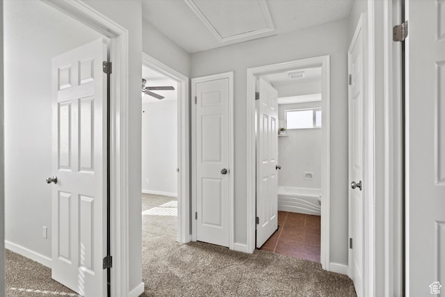 2124 N 2525 W, Clinton, UT 84015 - corridor featuring visible vents, tile patterned floors, carpet flooring, and baseboards