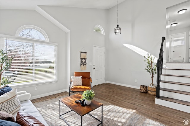 2124 N 2525 W, Clinton, UT 84015 - living room with plenty of natural light, stairway, baseboards, and wood finished floors