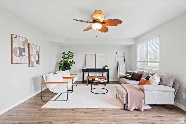 2124 N 2525 W, Clinton, UT 84015 - living room with wood finished floors, baseboards, and a ceiling fan
