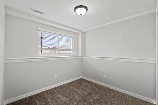 2124 N 2525 W, Clinton, UT 84015 - spare room featuring dark carpet, visible vents, and baseboards