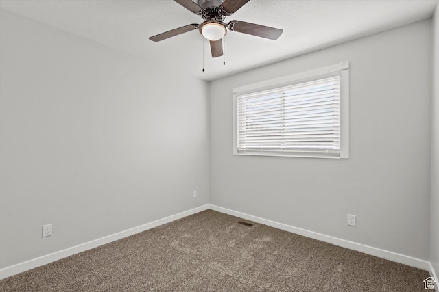 2124 N 2525 W, Clinton, UT 84015 - unfurnished room with dark carpet, ceiling fan, and baseboards