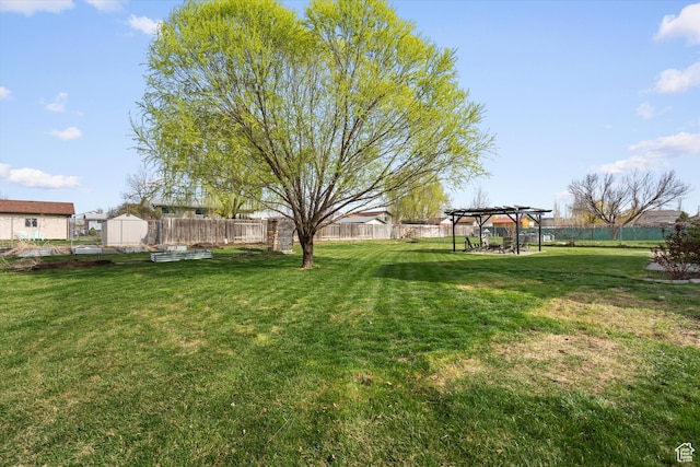 2124 N 2525 W, Clinton, UT 84015 - view of yard featuring a pergola and a fenced backyard