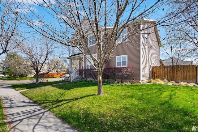 1468 N 220 W, Tooele, UT 84074 - view of side of home with fence and a lawn