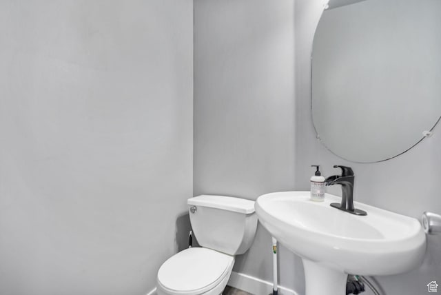 1468 N 220 W, Tooele, UT 84074 - bathroom with baseboards, a sink, and toilet