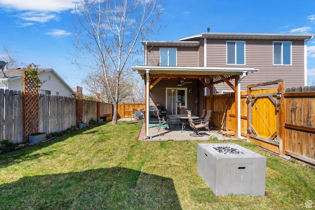 1468 N 220 W, Tooele, UT 84074 - back of property featuring ceiling fan, a lawn, a fenced backyard, a patio, and a gate