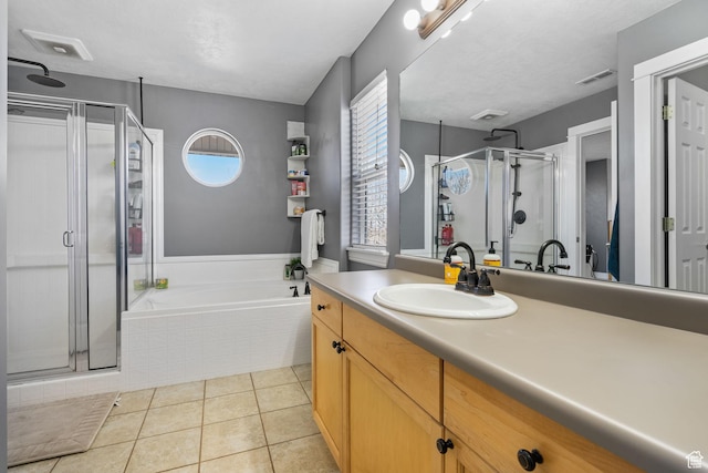 1468 N 220 W, Tooele, UT 84074 - bathroom featuring visible vents, a bath, vanity, tile patterned floors, and a stall shower
