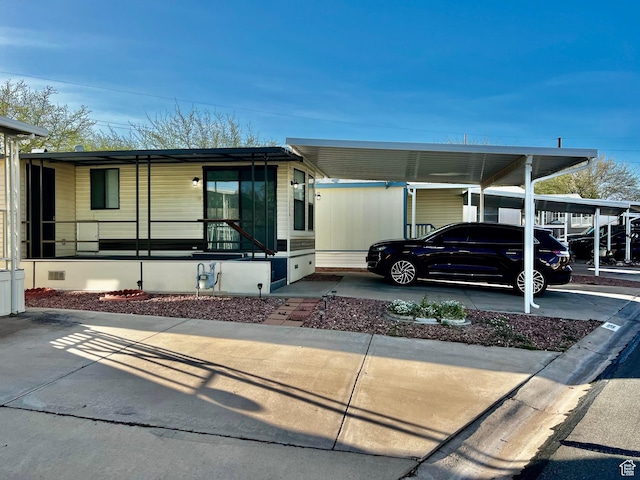 1160 E Telegraph St Unit 126, Washington, UT 84780 - manufactured / mobile home with a detached carport