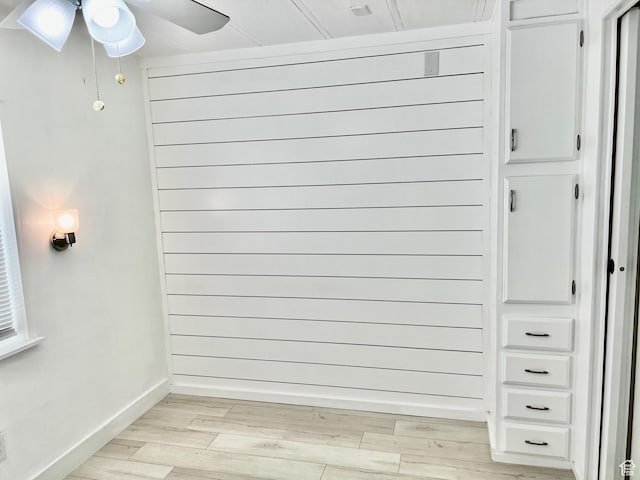 1160 E Telegraph St Unit 126, Washington, UT 84780 - room details featuring wooden walls, baseboards, a ceiling fan, and wood finished floors