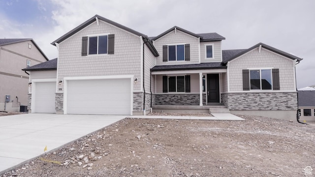 876 W Sika Cir S Unit 205, Saratoga Springs, UT 84045 - craftsman-style home with covered porch, stone siding, driveway, and a garage