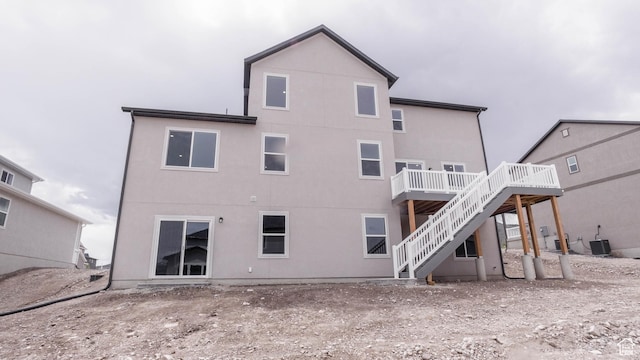 876 W Sika Cir S Unit 205, Saratoga Springs, UT 84045 - back of property with stairs, a wooden deck, and stucco siding