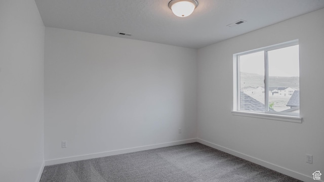 876 W Sika Cir S Unit 205, Saratoga Springs, UT 84045 - carpeted empty room featuring baseboards