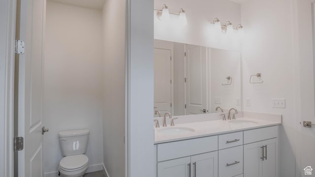 876 W Sika Cir S Unit 205, Saratoga Springs, UT 84045 - bathroom featuring double vanity and toilet