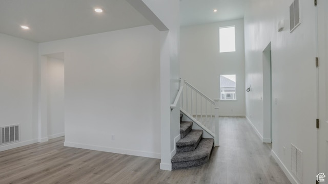876 W Sika Cir S Unit 205, Saratoga Springs, UT 84045 - foyer entrance with light wood finished floors, plenty of natural light, stairs, and recessed lighting