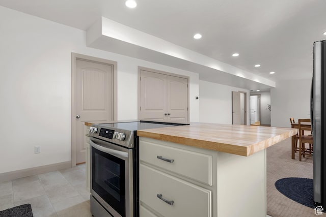 814 N 1490 E, Heber City, UT 84032 - kitchen with light tile patterned floors, white cabinetry, recessed lighting, stainless steel appliances, and wood counters