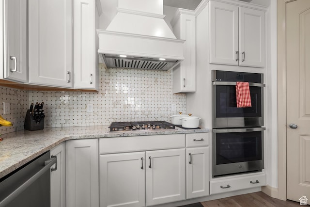 814 N 1490 E, Heber City, UT 84032 - kitchen with custom exhaust hood, tasteful backsplash, white cabinetry, light stone countertops, and appliances with stainless steel finishes
