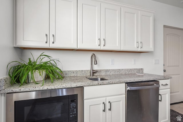 814 N 1490 E, Heber City, UT 84032 - kitchen featuring light stone countertops, white cabinets, dishwasher, a sink, and built in microwave