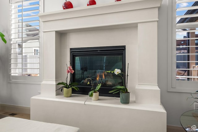 814 N 1490 E, Heber City, UT 84032 - room details featuring baseboards, a glass covered fireplace, and visible vents