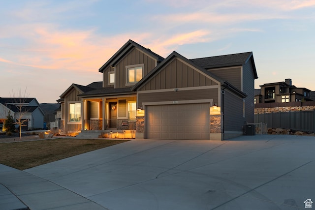 814 N 1490 E, Heber City, UT 84032 - craftsman inspired home featuring stone siding, covered porch, board and batten siding, fence, and concrete driveway