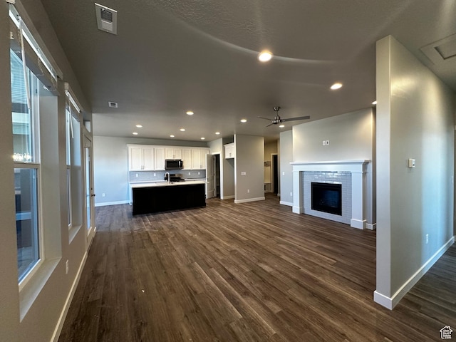 3778 S 4250 W Unit 435, West Haven, UT 84401 - unfurnished living room featuring baseboards, dark wood-type flooring, a ceiling fan, and recessed lighting