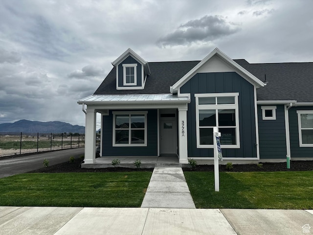 3778 S 4250 W Unit 435, West Haven, UT 84401 - view of front facade with board and batten siding, a porch, and a mountain view