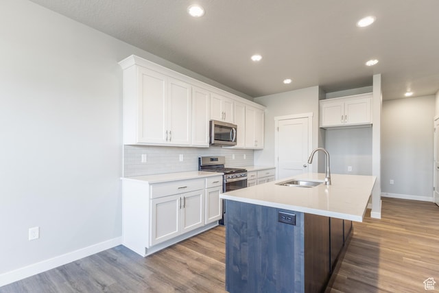 3778 S 4250 W Unit 435, West Haven, UT 84401 - kitchen featuring stainless steel appliances, wood finished floors, white cabinets, and recessed lighting