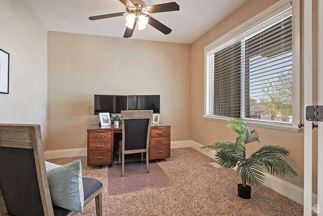 home office featuring ceiling fan and baseboards