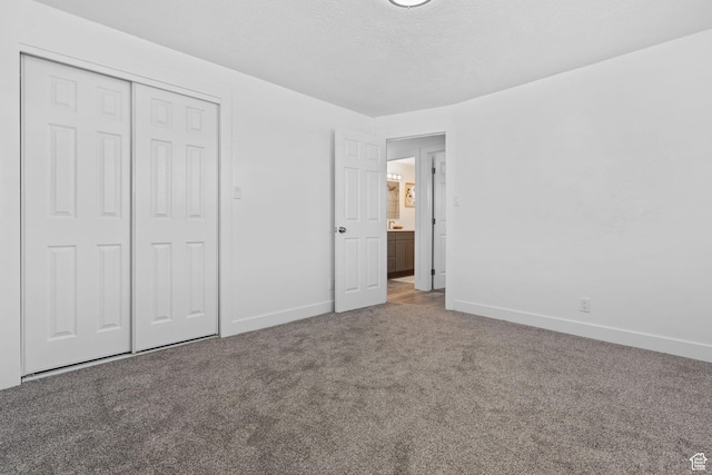 621 N 200 W, Clearfield, UT 84015 - unfurnished bedroom with a closet, baseboards, carpet flooring, and a textured ceiling