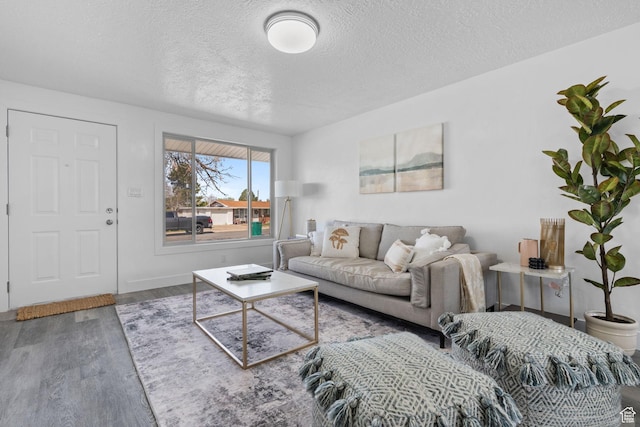 621 N 200 W, Clearfield, UT 84015 - living area with baseboards, wood finished floors, and a textured ceiling