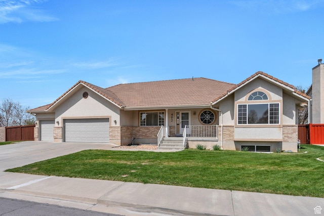 ranch-style home featuring a tiled roof, a garage, a front yard, and fence