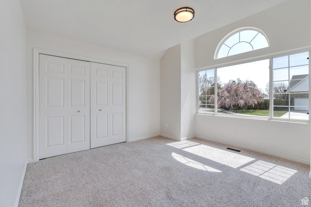492 W 175 N, Orem, UT 84057 - unfurnished bedroom with visible vents, baseboards, a closet, vaulted ceiling, and carpet flooring