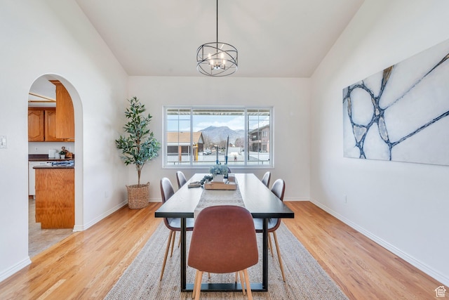 492 W 175 N, Orem, UT 84057 - dining room with arched walkways, light wood finished floors, and baseboards