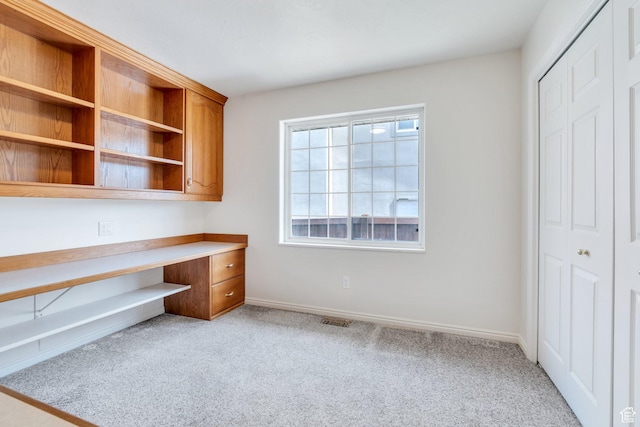 492 W 175 N, Orem, UT 84057 - unfurnished office with baseboards, visible vents, built in desk, and light colored carpet