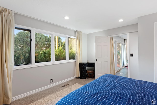 819 N Juniperpoint Dr, Salt Lake City, UT 84103 - carpeted bedroom featuring visible vents, baseboards, multiple windows, and recessed lighting