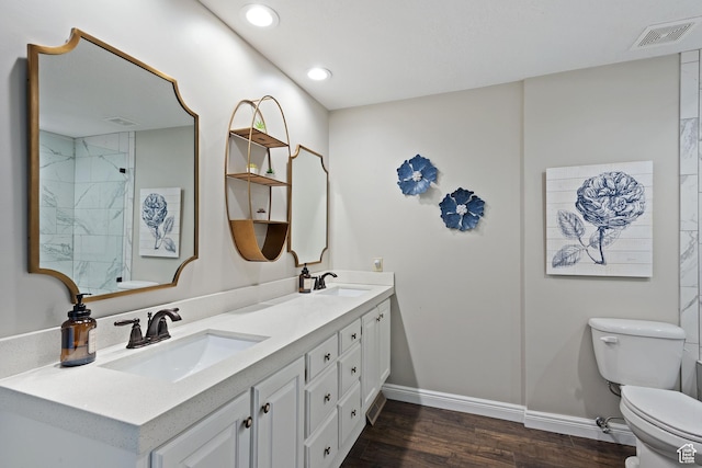 819 N Juniperpoint Dr, Salt Lake City, UT 84103 - bathroom featuring visible vents, a sink, toilet, and wood finished floors