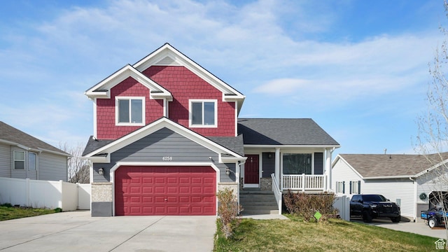 6258 W Graceland Way, West Jordan, UT 84081 - view of front of house featuring concrete driveway, a front yard, a garage, fence, and covered porch