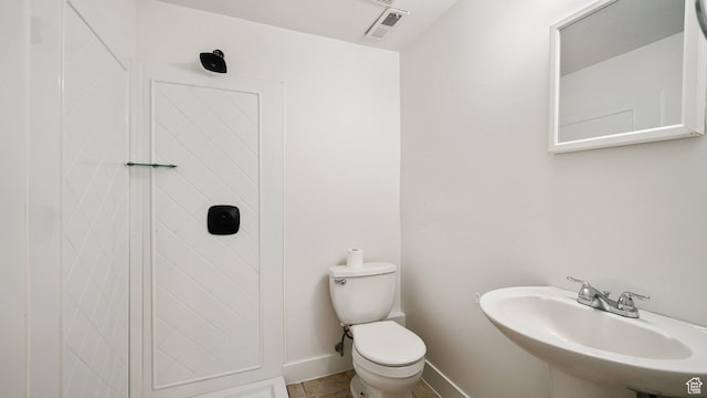 6258 W Graceland Way, West Jordan, UT 84081 - half bathroom with tile patterned flooring, visible vents, toilet, a sink, and baseboards
