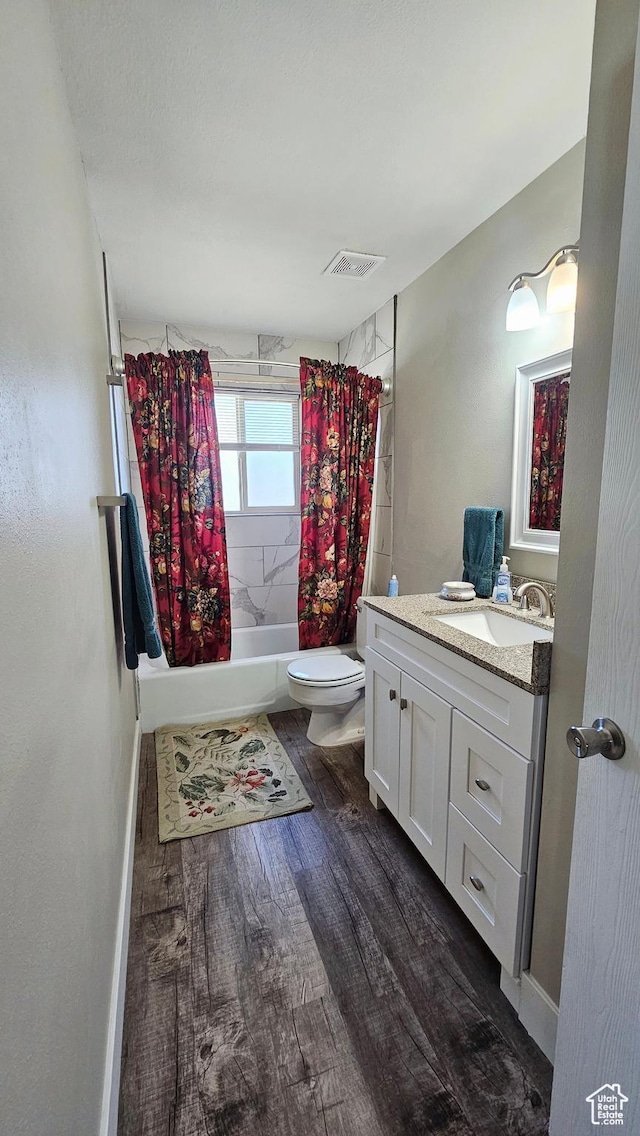 443 S 600 W, Vernal, UT 84078 - full bathroom featuring wood finished floors, shower / tub combo with curtain, toilet, and vanity