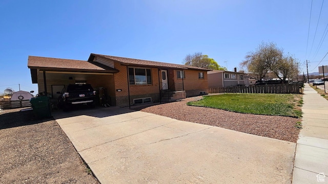 443 S 600 W, Vernal, UT 84078 - view of front of property with concrete driveway, a carport, and brick siding