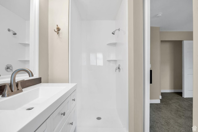 1962 E 7700 S, South Weber, UT 84405 - bathroom with vanity, baseboards, and walk in shower