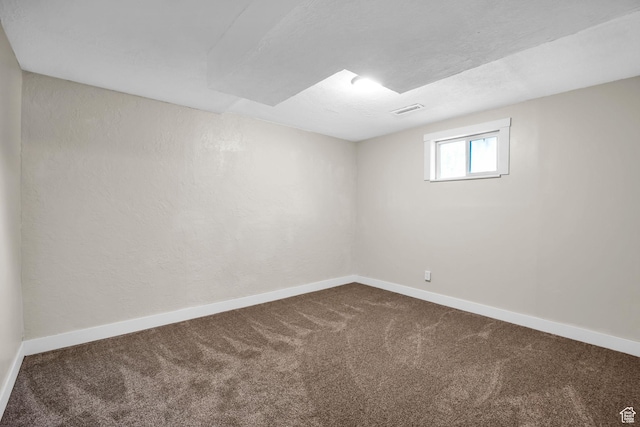 1962 E 7700 S, South Weber, UT 84405 - empty room featuring visible vents, baseboards, and dark carpet