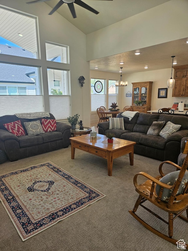 2345 E Cherry Ln, Layton, UT 84040 - carpeted living area with high vaulted ceiling, recessed lighting, and ceiling fan with notable chandelier