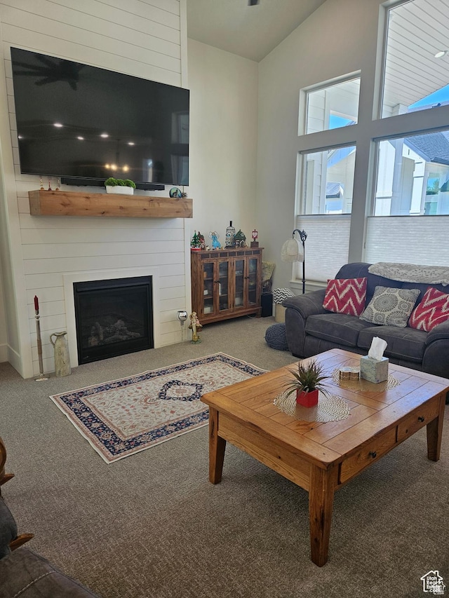 2345 E Cherry Ln, Layton, UT 84040 - carpeted living room with a fireplace and lofted ceiling