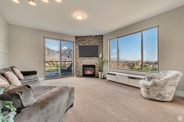 11968 N Ithica Dr, Highland, UT 84003 - living area featuring light carpet, a stone fireplace, and baseboards