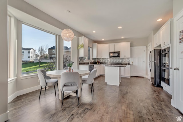 11968 N Ithica Dr, Highland, UT 84003 - dining area featuring baseboards, recessed lighting, and dark wood finished floors