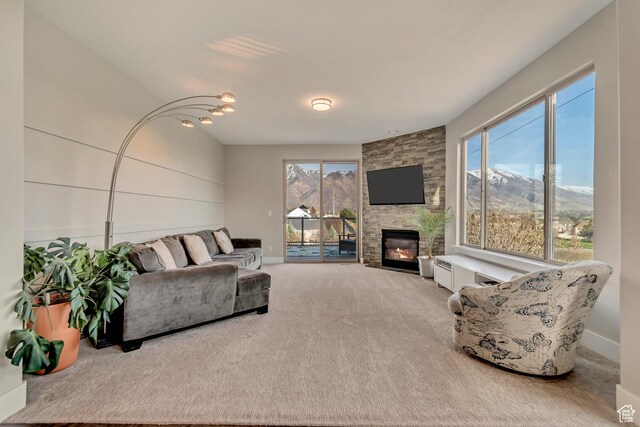 11968 N Ithica Dr, Highland, UT 84003 - carpeted living room with a fireplace, baseboards, and a healthy amount of sunlight