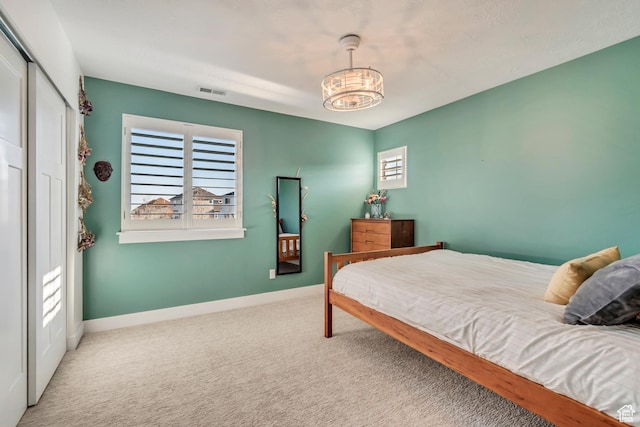 11968 N Ithica Dr, Highland, UT 84003 - carpeted bedroom featuring visible vents, baseboards, a closet, and a notable chandelier