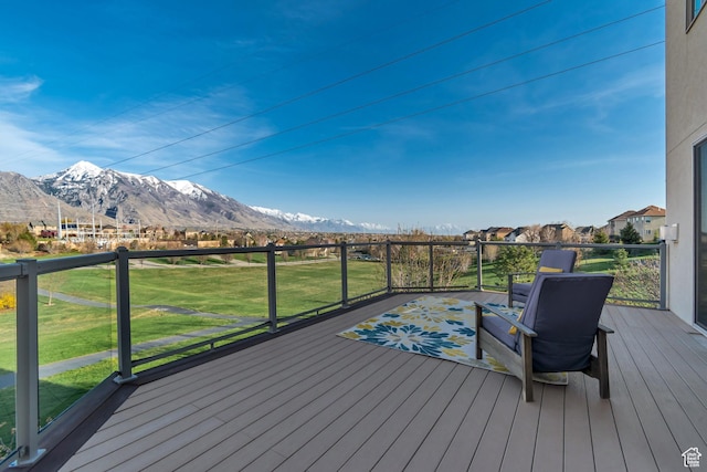 11968 N Ithica Dr, Highland, UT 84003 - wooden deck with a mountain view and a lawn