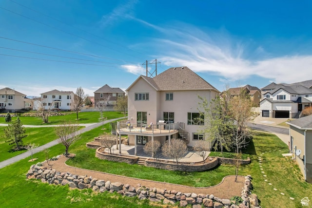11968 N Ithica Dr, Highland, UT 84003 - back of property with a residential view, a patio, stucco siding, stairs, and a yard