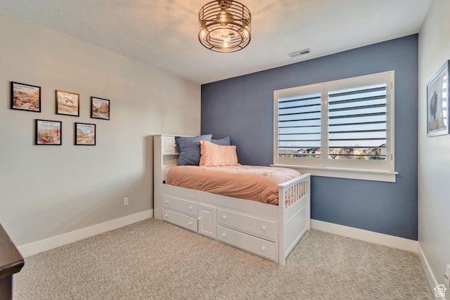 11968 N Ithica Dr, Highland, UT 84003 - bedroom with light carpet, visible vents, multiple windows, and baseboards