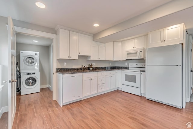 11968 N Ithica Dr, Highland, UT 84003 - kitchen featuring baseboards, stacked washer and clothes dryer, white appliances, white cabinetry, and light wood finished floors